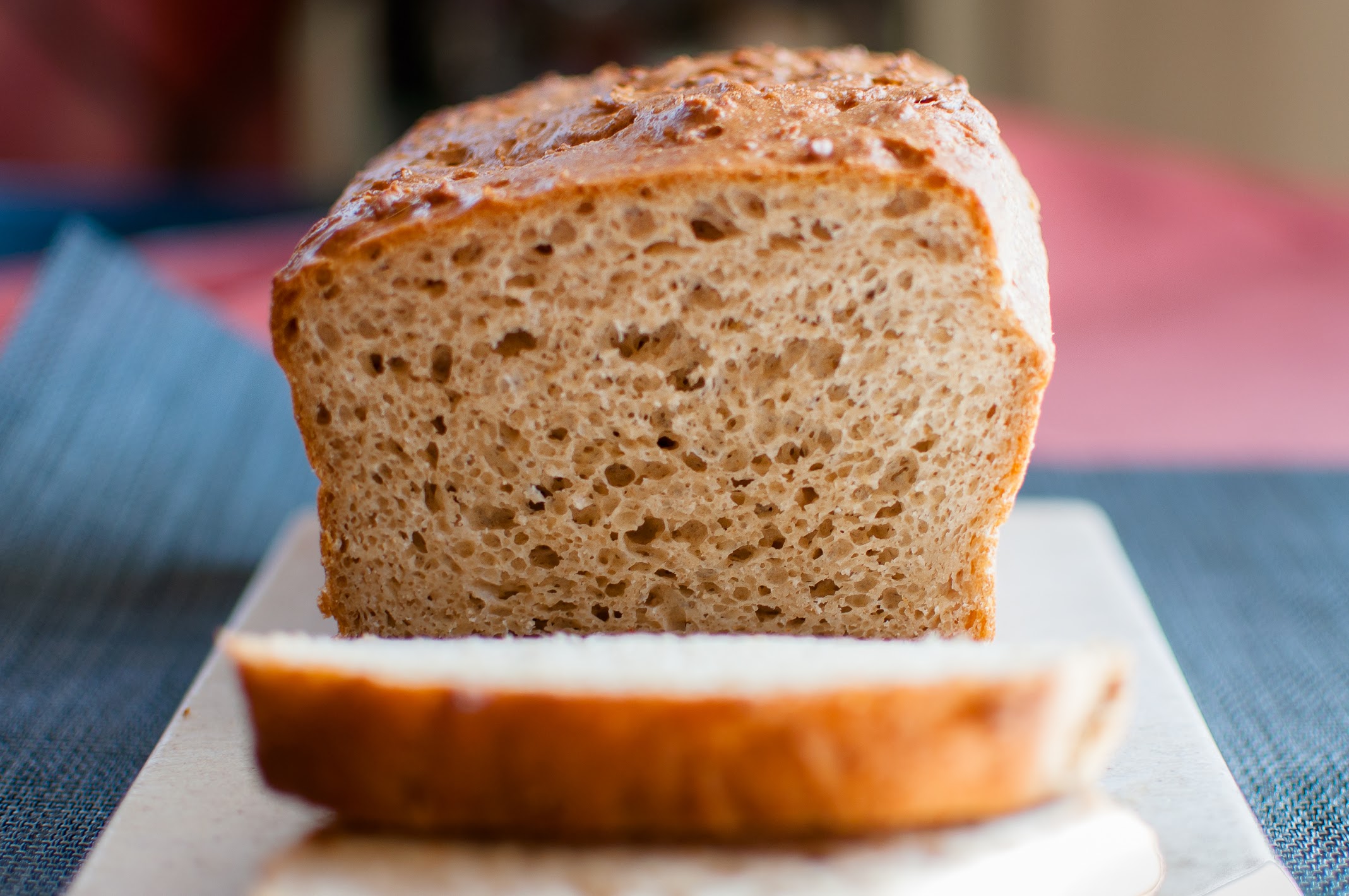 A sliced loaf of gluten-free whole grain bread